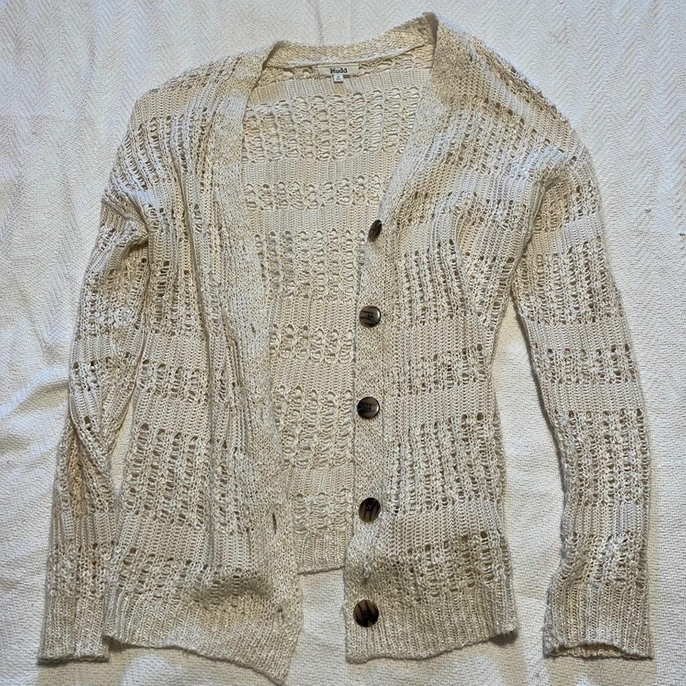 Sweater throw with buttons